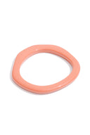 Pink bangle on a white background