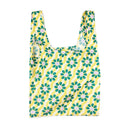 Reusable shopping bag with floral pattern on a yellow background