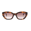Sunglasses with tortoiseshell frame and pink gradient lenses on a white background